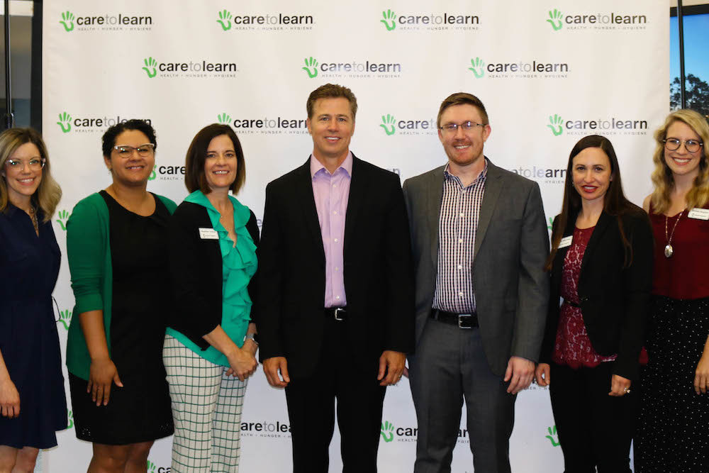 Care to Learn founder Doug Pitt and new Executive Director Christian Mechlin, center, are flanked by staff members Melissa Rea, Jhasmine Watson and Heather Trinca, on the left, and Annie Mayrose and Michelle Houghton, on the right.